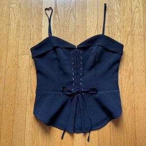 Black sleeveless top with lacing details